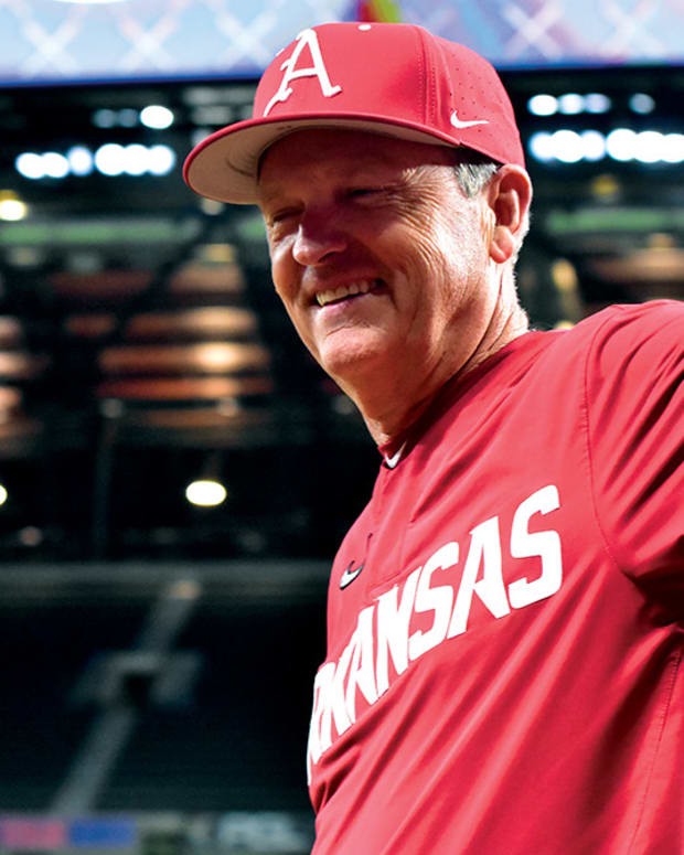 Arkansas coach Dave Van Horn is all smiles after the Razorbacks finally put up a run on Oklahoma State in the fifth inning at Globe Life Field.